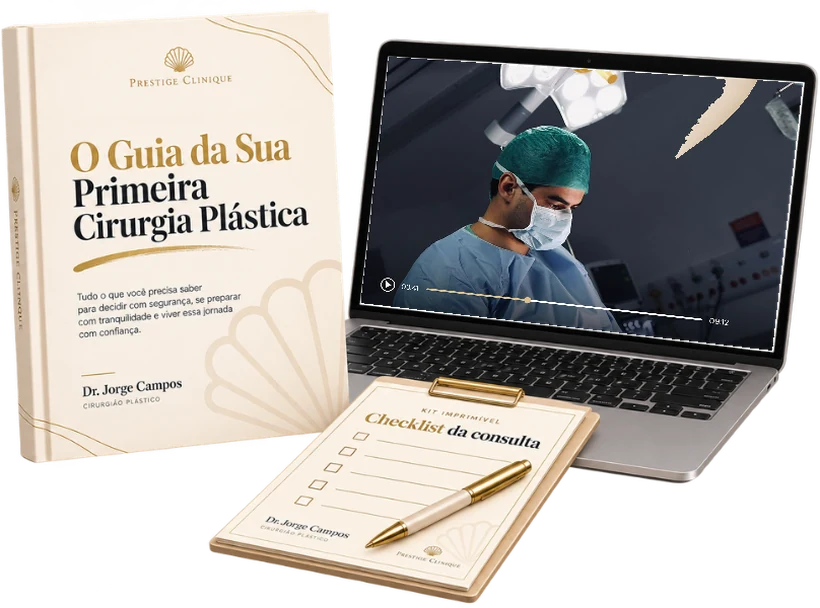 O guia impresso, a aula em reprodução no notebook com o Dr. Jorge em cirurgia e o Kit Imprimível na prancheta